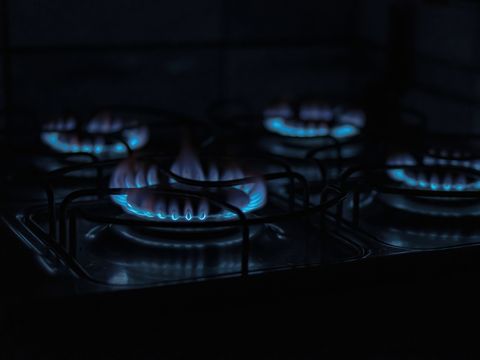 Blue flames on a gas cooktop