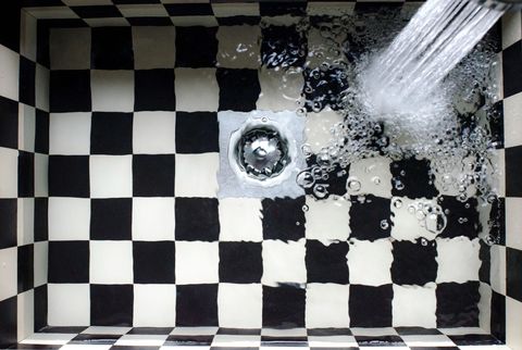 Water running into a sink plughole